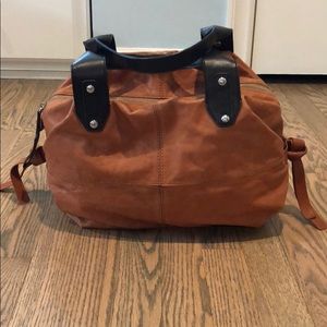 Tan with brown handles Kooba leather pocketbook.